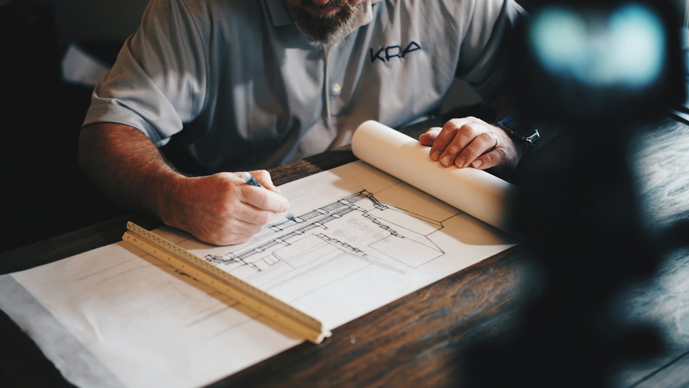 Construction professional reviewing architectural plans